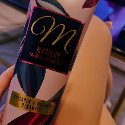 Tube of Onyx Mystery sunbed tanning accelerator cream on leg, close-up of packaging