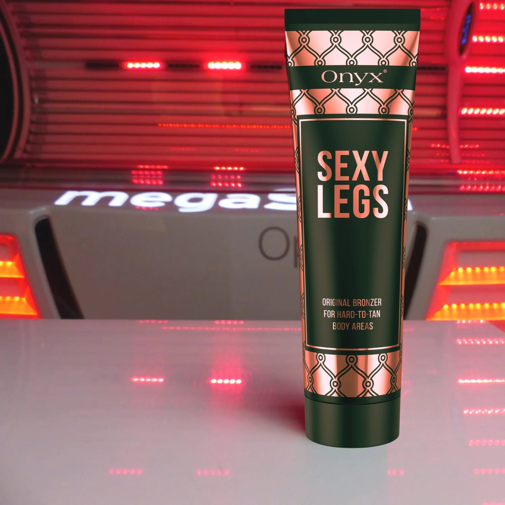 Onyx Sexy Legs bronzing cream standing in front of a red-lit sunbed inside a tanning studio