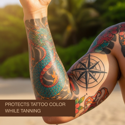Bright tattoo sleeve on arm showing colour protection while tanning with Onyx Tattoo bronzing sunbed cream