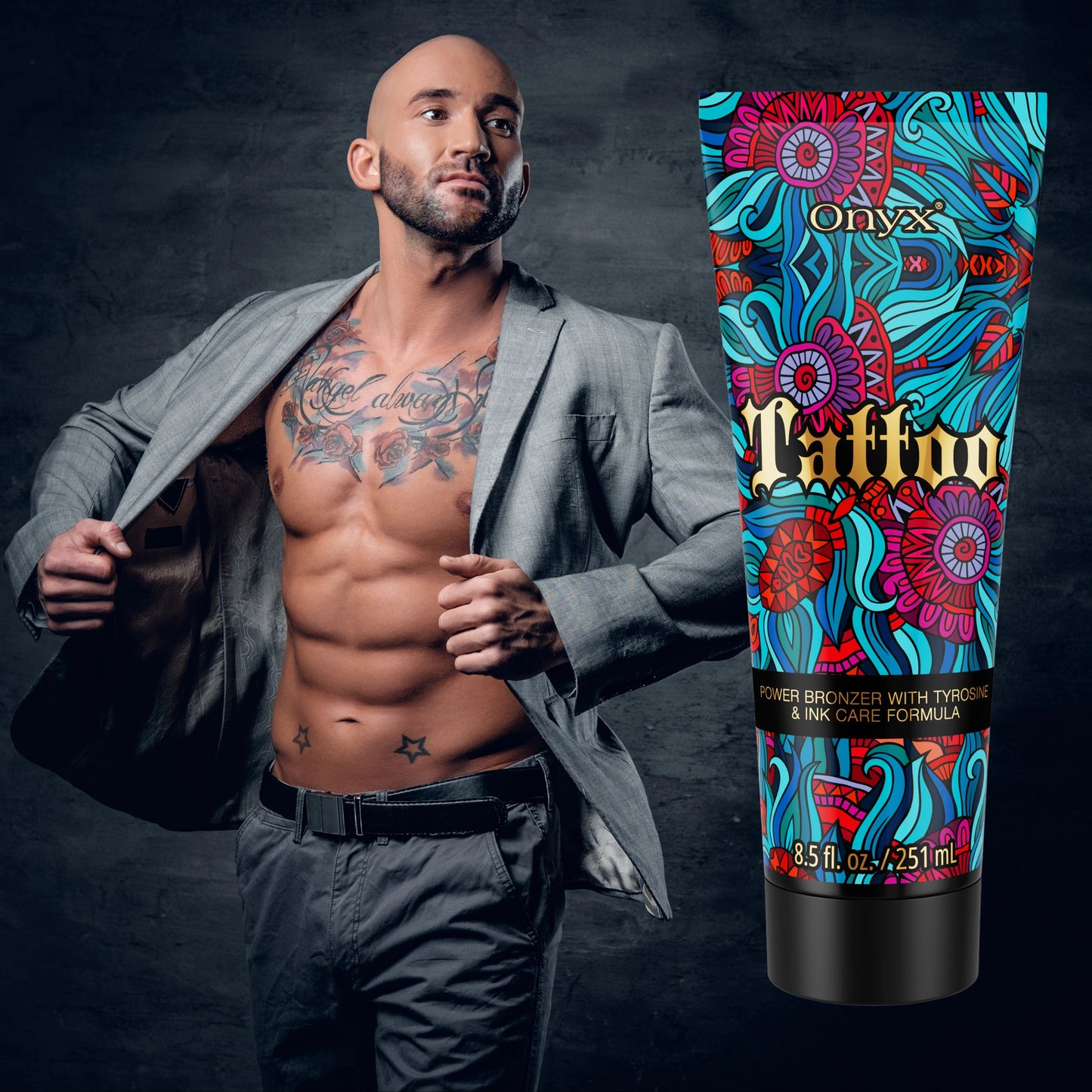 Onyx Tattoo Tanning Lotion with a tattooed male model in a suit, showcasing tattoo protection and bronzing power.